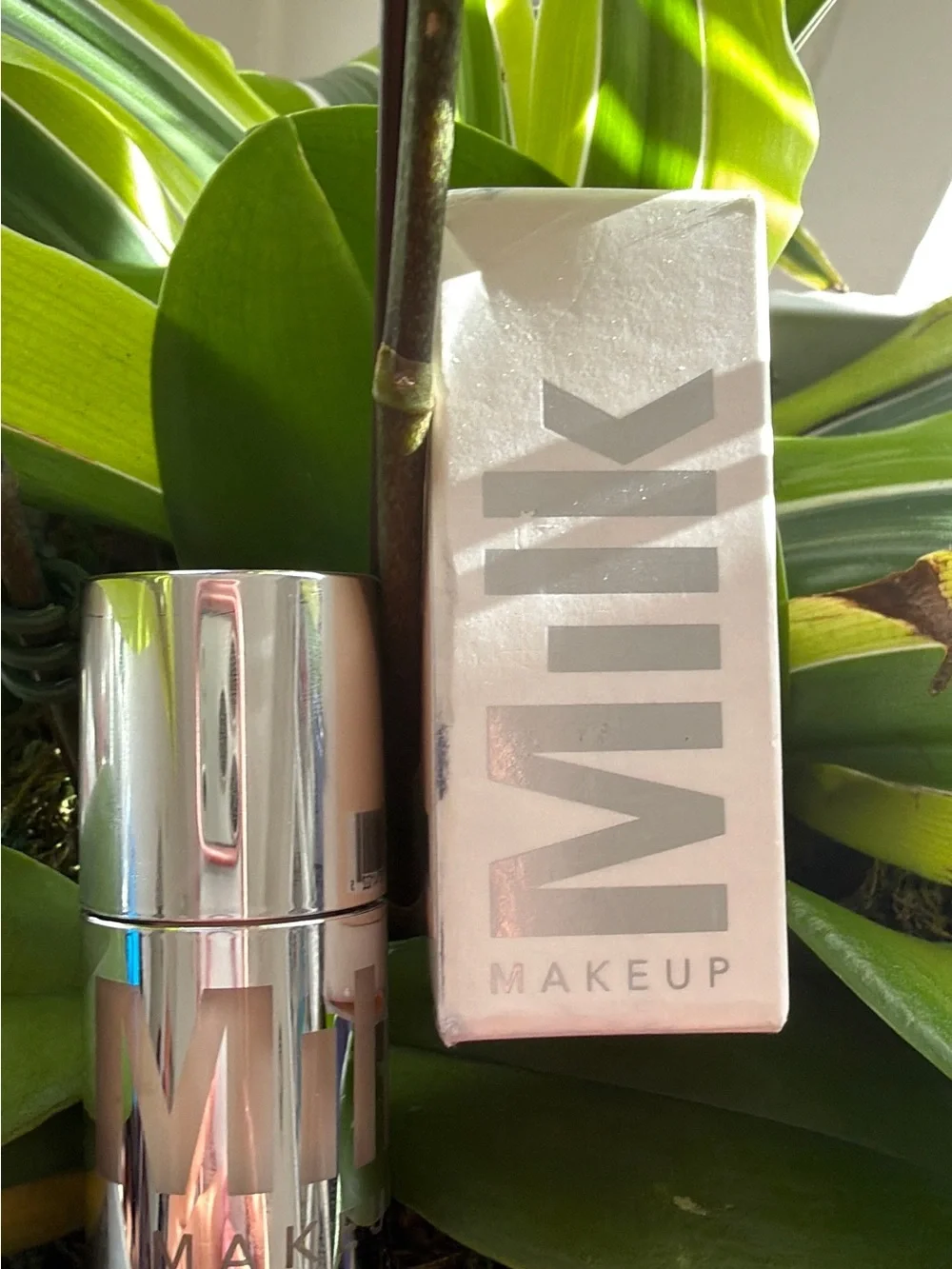 Milk Makeup Primer Stick in Shiny Silver Case with Soft Pink Box